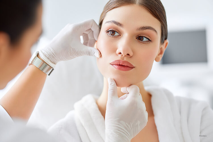 Woman getting her face looked at