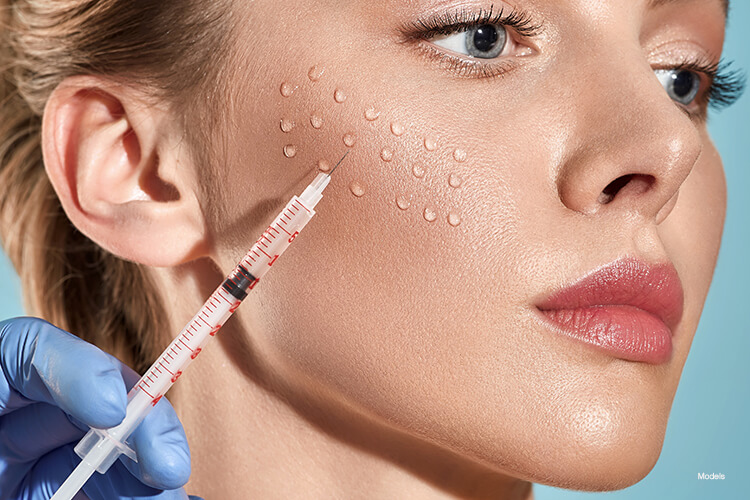 Woman getting an injection on her cheek