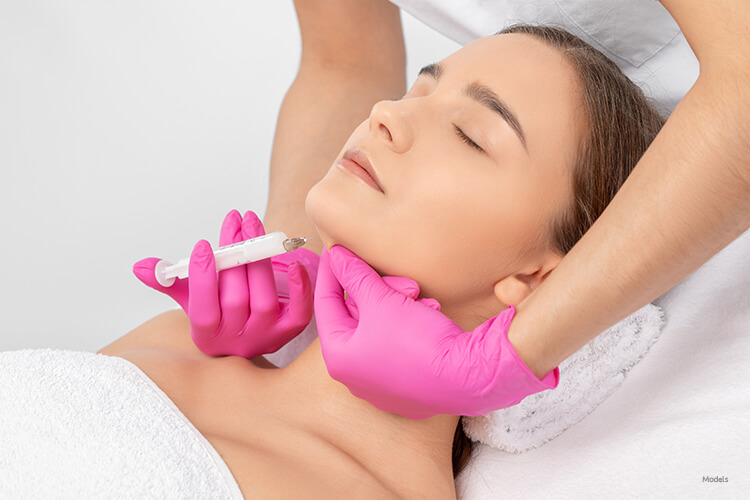 Woman getting an injection under her chin